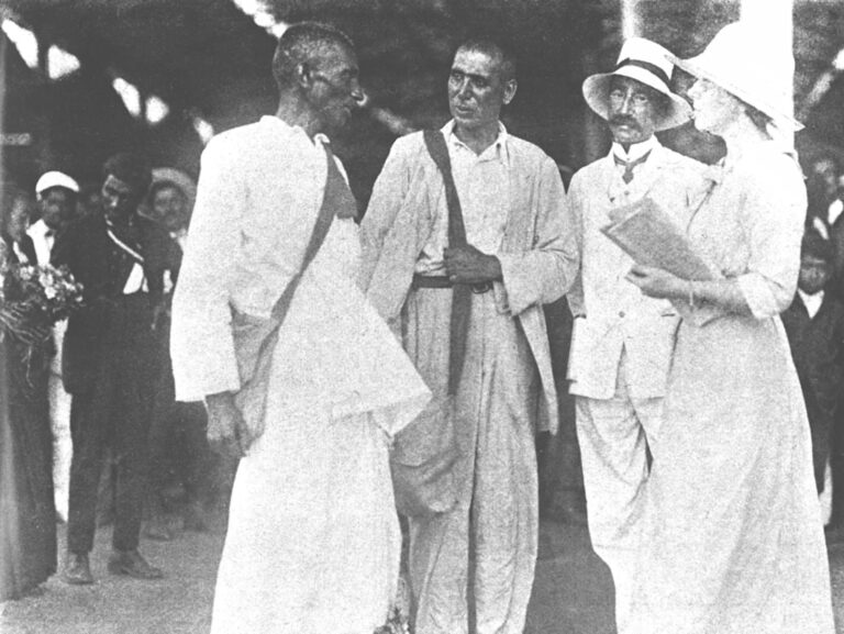 Gandhi in discussion with co-workers at Maritzburg Railway Station, South Africa, December 1913